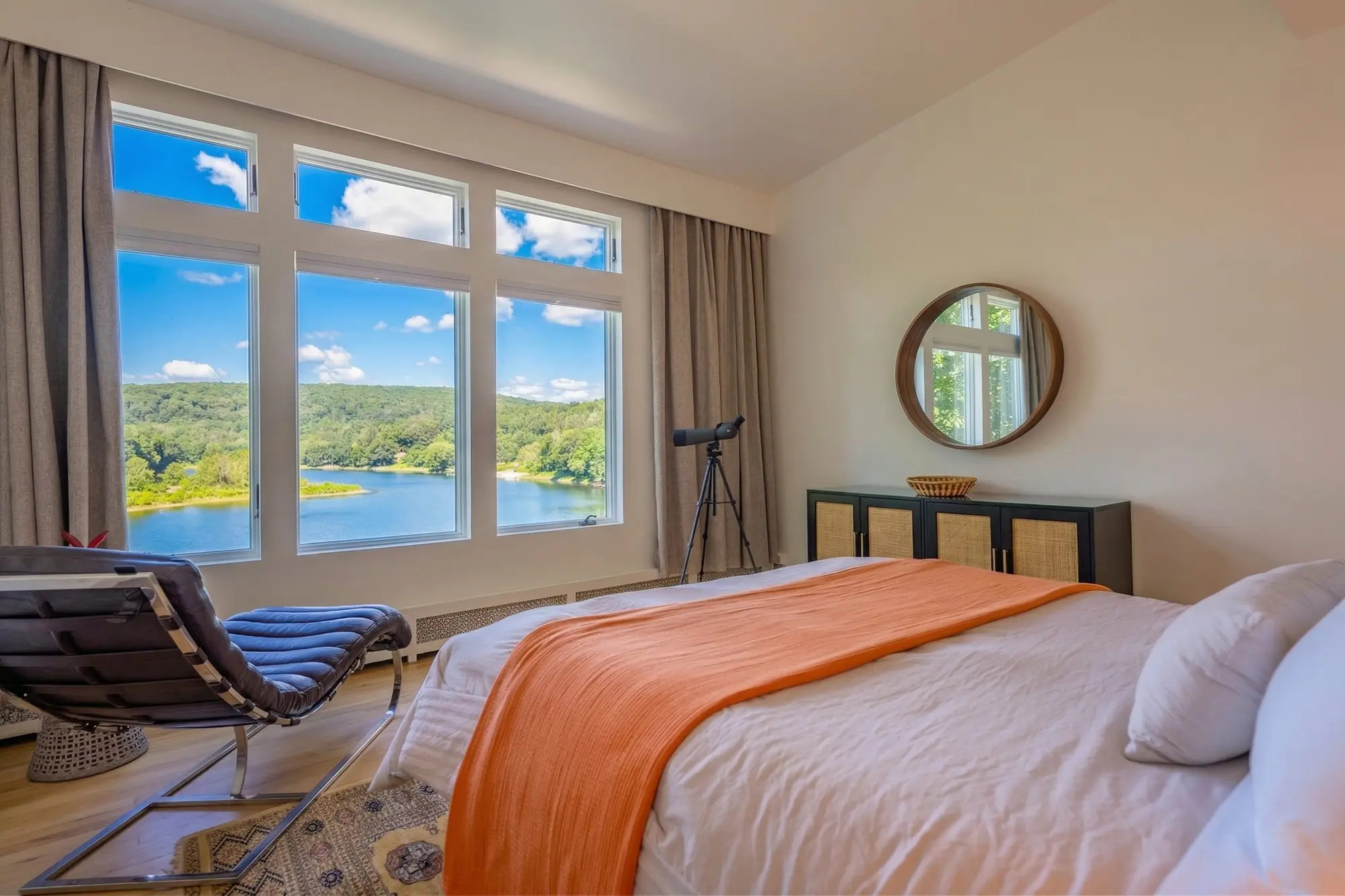 River View Queen bedroom at River Penthouse with spotting scope, Delaware River view, and chaise lounge, Narrowsburg NY