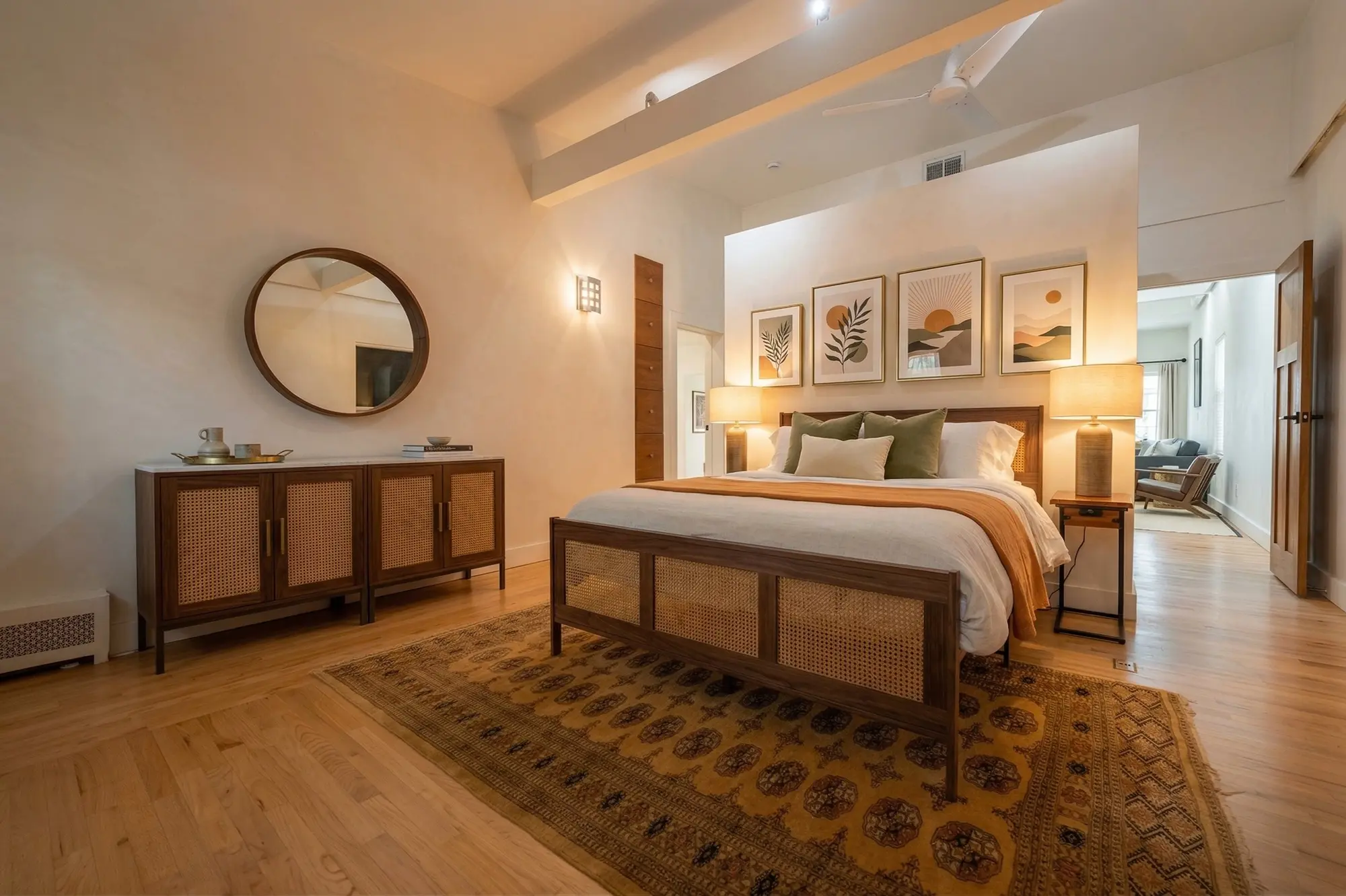 River Penthouse master bedroom with king-size cane bed and mid-century furniture, Narrowsburg NY